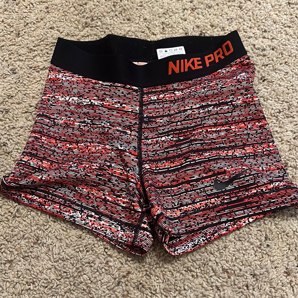 Nike Pros Red, orange, and peach size small